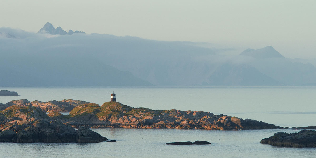 The picture shows a calm landscape at the sea with a lighthouse. It stands for good intentions, which like a lighthouse help us to find our way through difficult times.